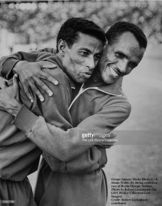 Oromo (Oromian) runners Abebe Bikila (L) & Mamo Wolde (R) during exhibition race at Berlin Olympic Stadium. (Photo by Robert Lackenbach.The LIFE Picture Collection.Getty Images)